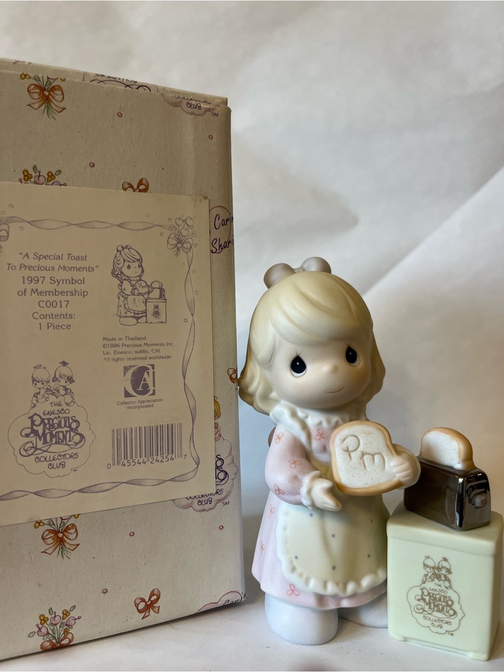 Precious Moments Girl Figurine in Pink and Cream Holding Toast